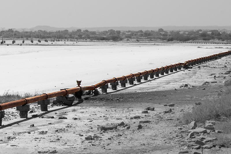 Integrated Solution for Rural Drinking Water Challenges - old dilapidated piped water supply line conveying freshwater across salty stretches in Kutch district, Gujarat